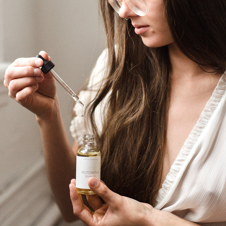 only hair oil in hand dripping