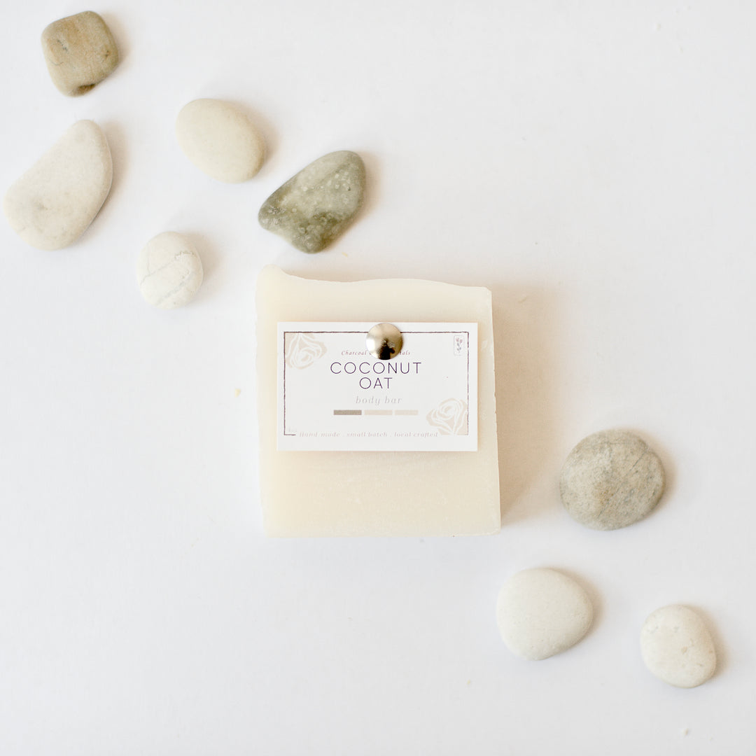 White coconut oat body bar with pebbles